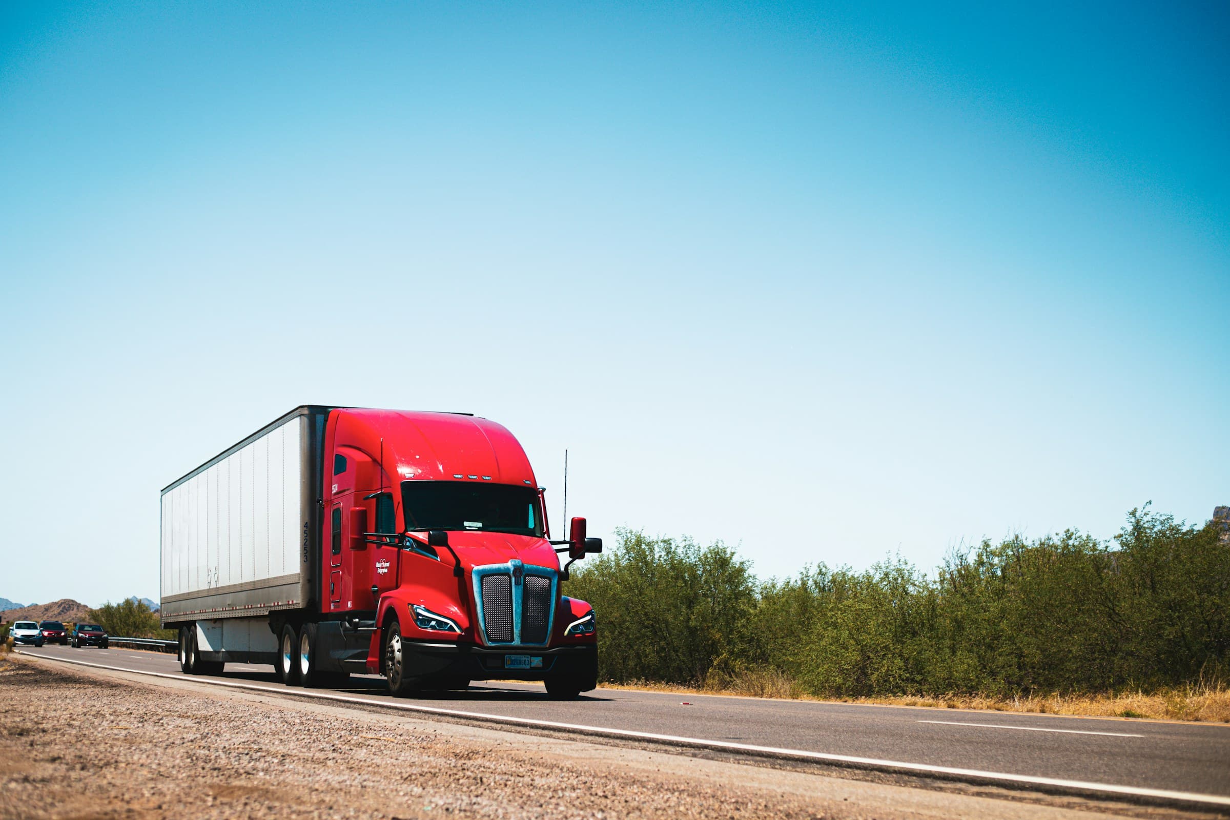 Semi-truck hauling a freight trailer on a highway